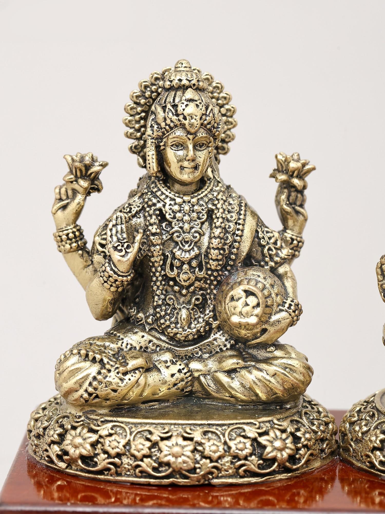 7" Superfine Trio of Goddess Lakshmi, Lord Ganesha and Goddess Saraswati with Wood Base | Brass Idol - 2