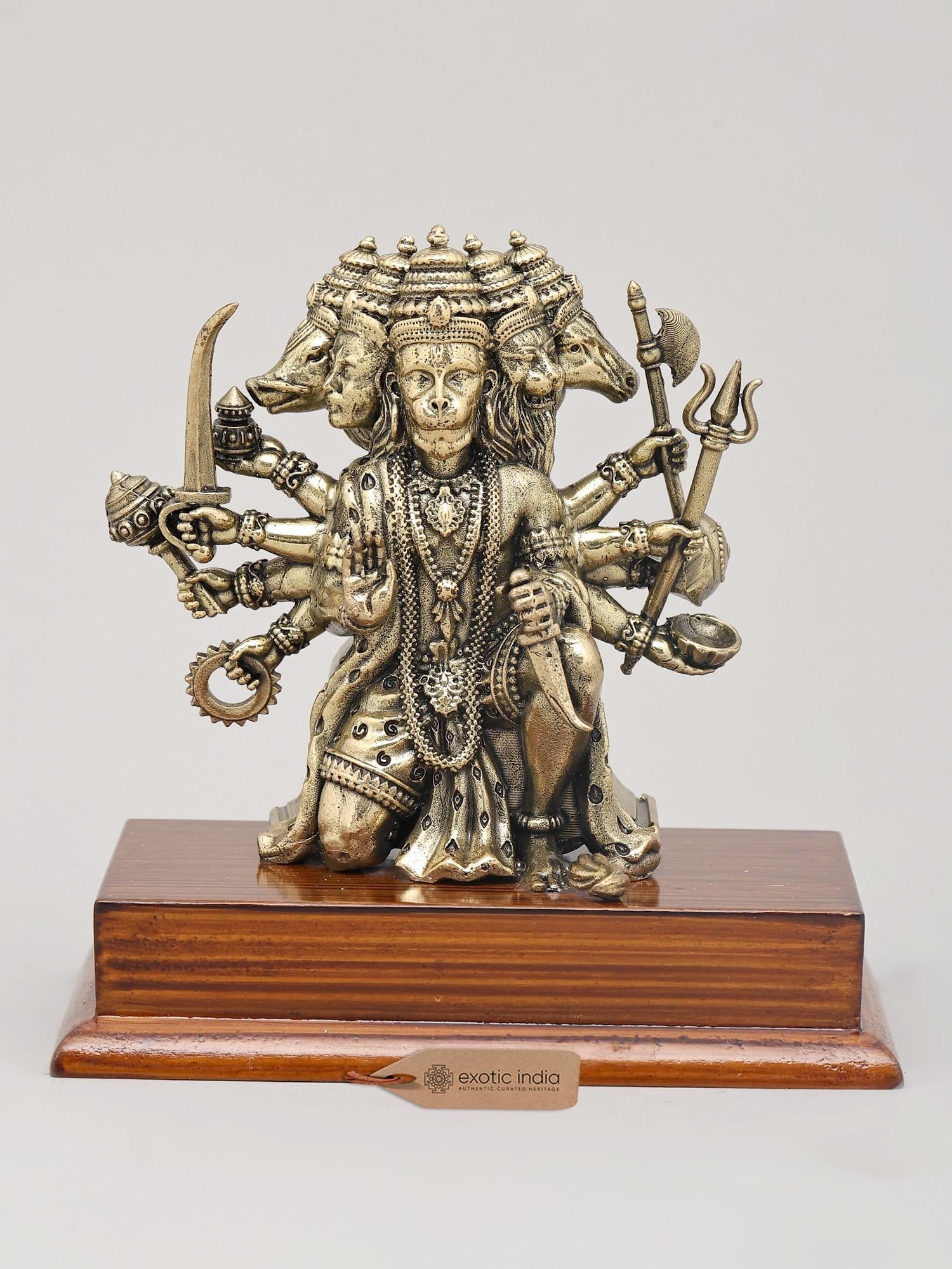 5" Small Superfine Panchamukhi Lord Hanuman in Seated Gesture on Wood Base | Brass Statue: Embodiment of Divine Power: The Panchamukhi Hanuman This exquisite brass statue captures the awe-inspiring Panchamukhi Hanuman, the five-faced manifestation of the revered deity. Lord Hanuman, a