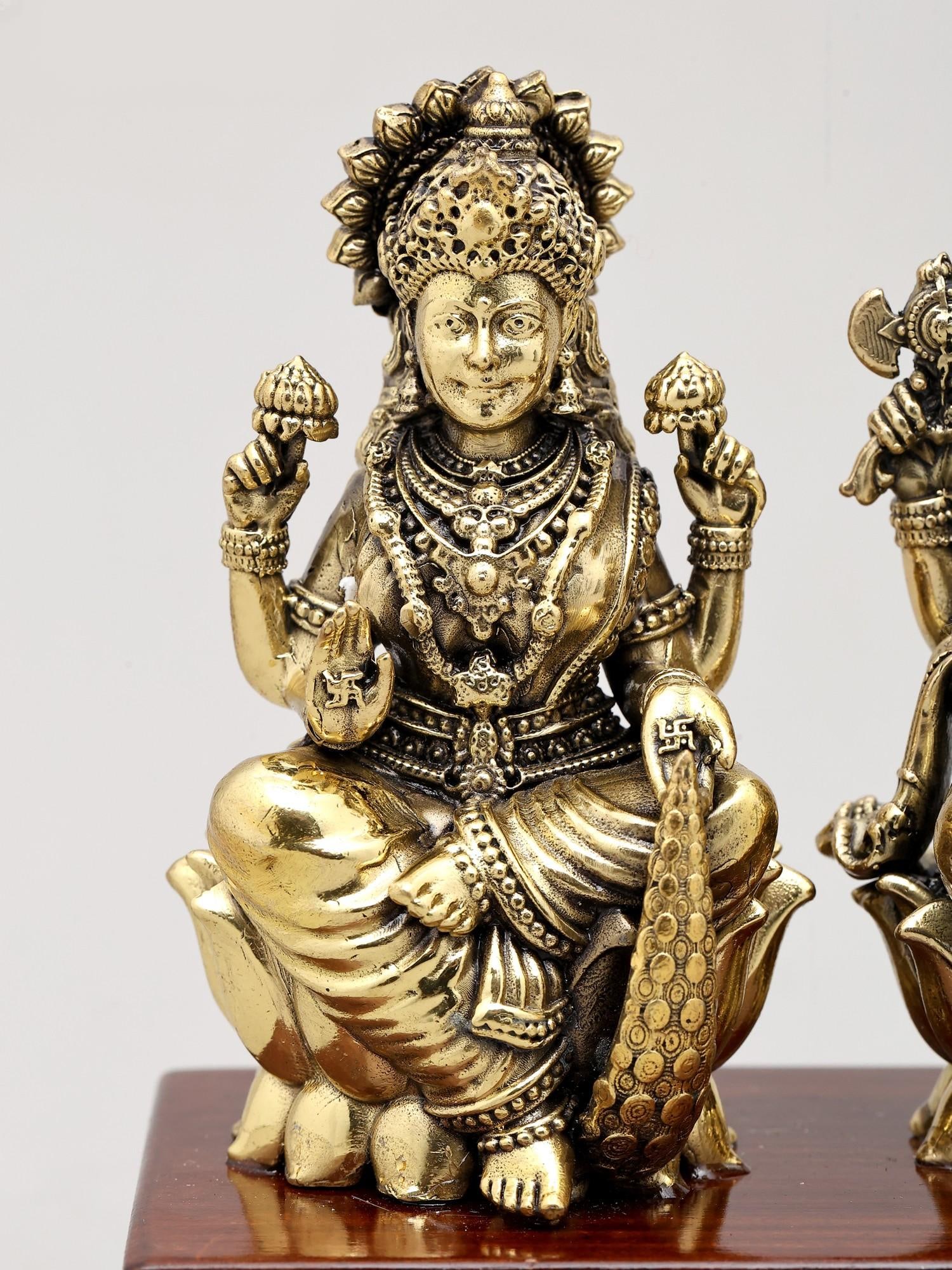 7" Superfine Idol of Lakshmi Ganesha and Saraswati Seated on Wood Base | Brass Sculpture - 2