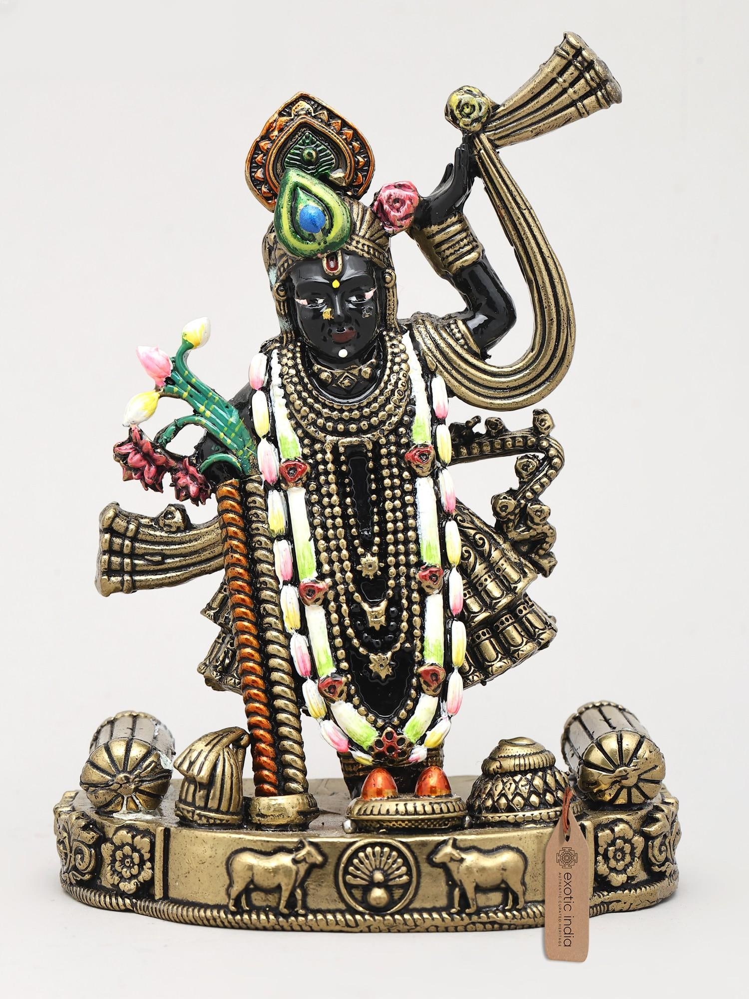 5" Small Blessings of Lord Krishna in Shrinathji Form | Brass Sculpture: A Divine Embodiment of Lord Krishna This exquisite brass sculpture captures the divine presence of Lord Krishna in his revered Shrinathji form, a manifestation particularly venerated in the Brij regio