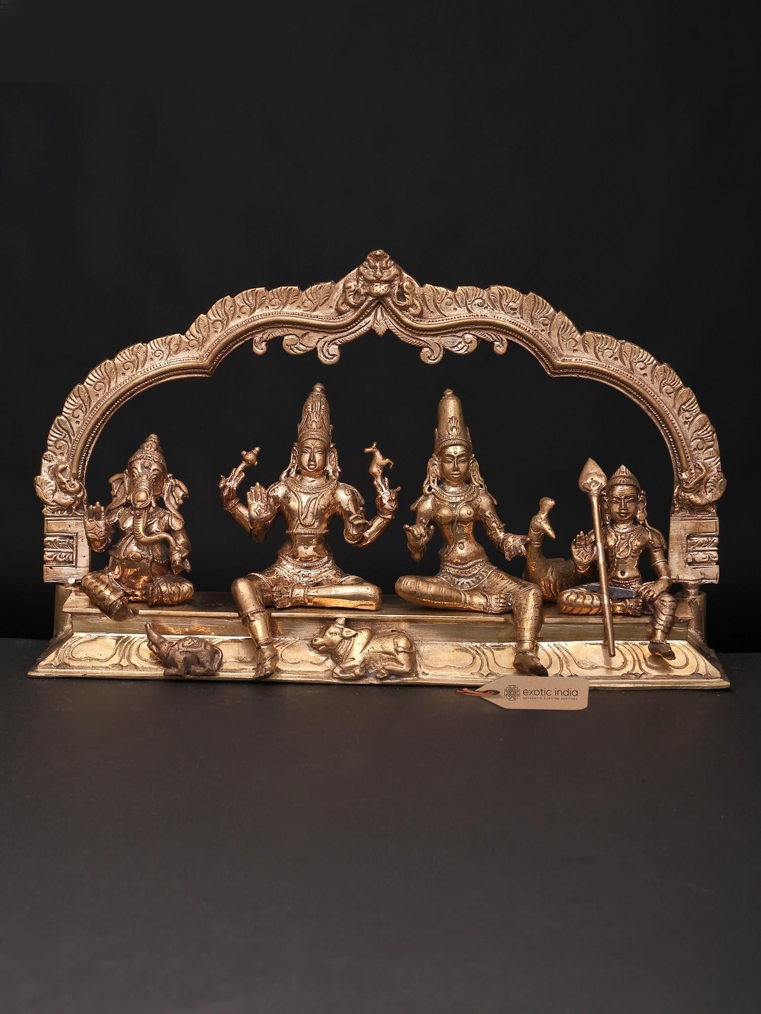 9" Lord Shiva Family Seated on Kirtimukha Throne | Bronze Statue | Made in India: A Divine Assemblage: The Lord Shiva Family on a Regal Throne This exquisite bronze sculpture captures the serene and harmonious essence of the divine family of Lord Shiva, seated majestically upon a K