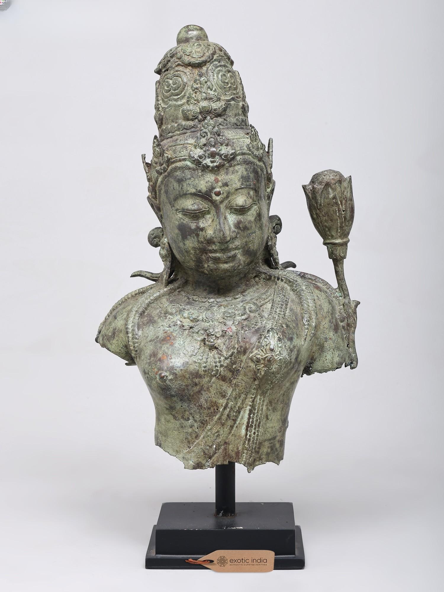19" Goddess Tara Bust | Balinese Brass Statue: A Vision of Compassion and Enlightenment This exquisite brass bust captures the serene countenance of Goddess Tara, a revered figure in both Buddhist and Hindu traditions, embodying compassion,