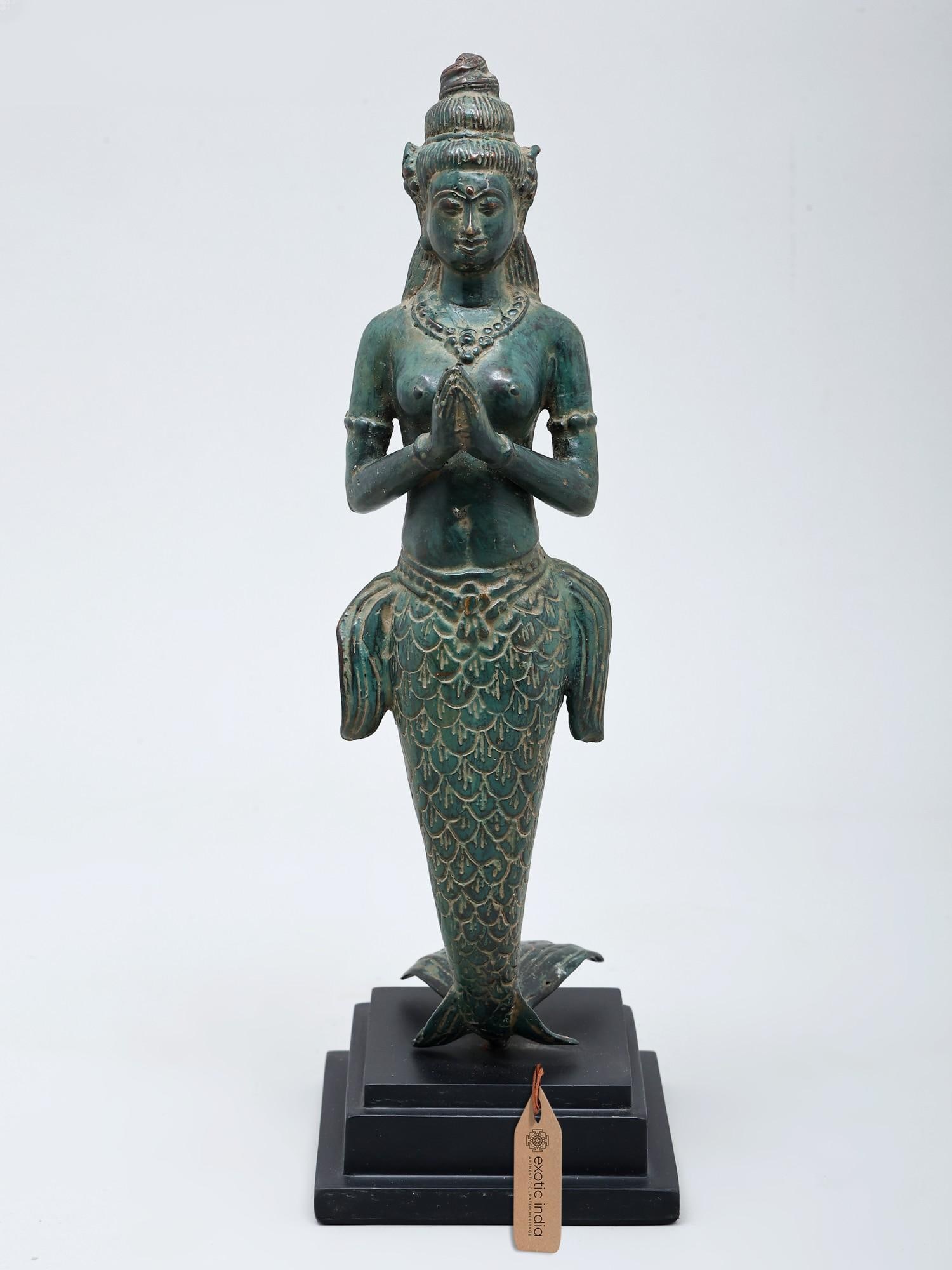 12" Suvannamaccha Mermaid | Balinese Brass Statue: Echoes of the Ocean's Embrace This exquisite brass statue captures the ethereal beauty of Suvannamaccha, a legendary mermaid figure deeply embedded in Southeast Asian folklore. Crafted using the