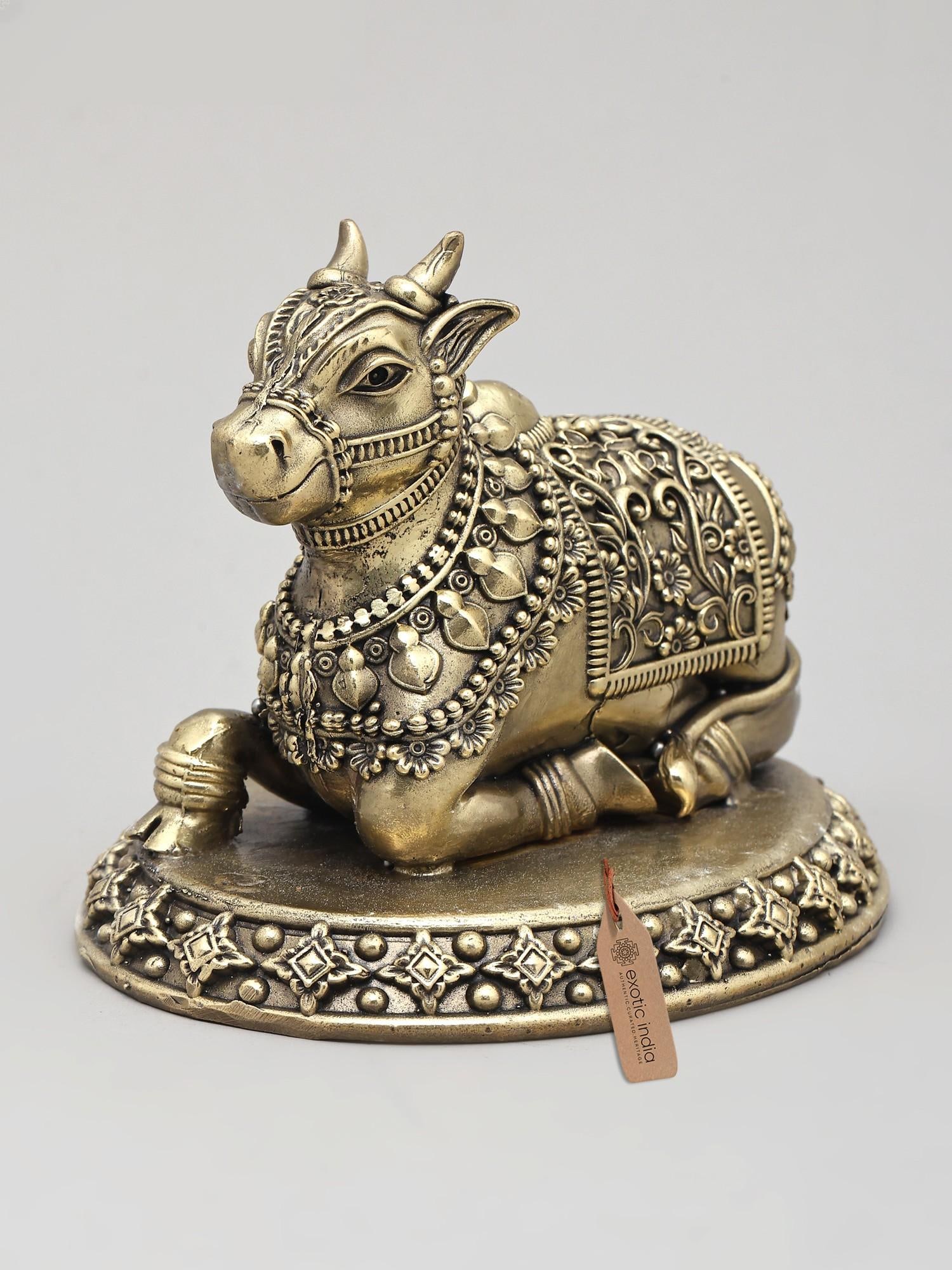 5" Small Superfine Nandi - Vahana of Lord Shiva | Brass Statue: The Ever-Faithful Vahana This exquisite brass statue captures the essence of Nandi, the beloved vahana (mount) of Lord Shiva. Rendered in a seated posture, Nandi embodies devotion, loyalty, and streng