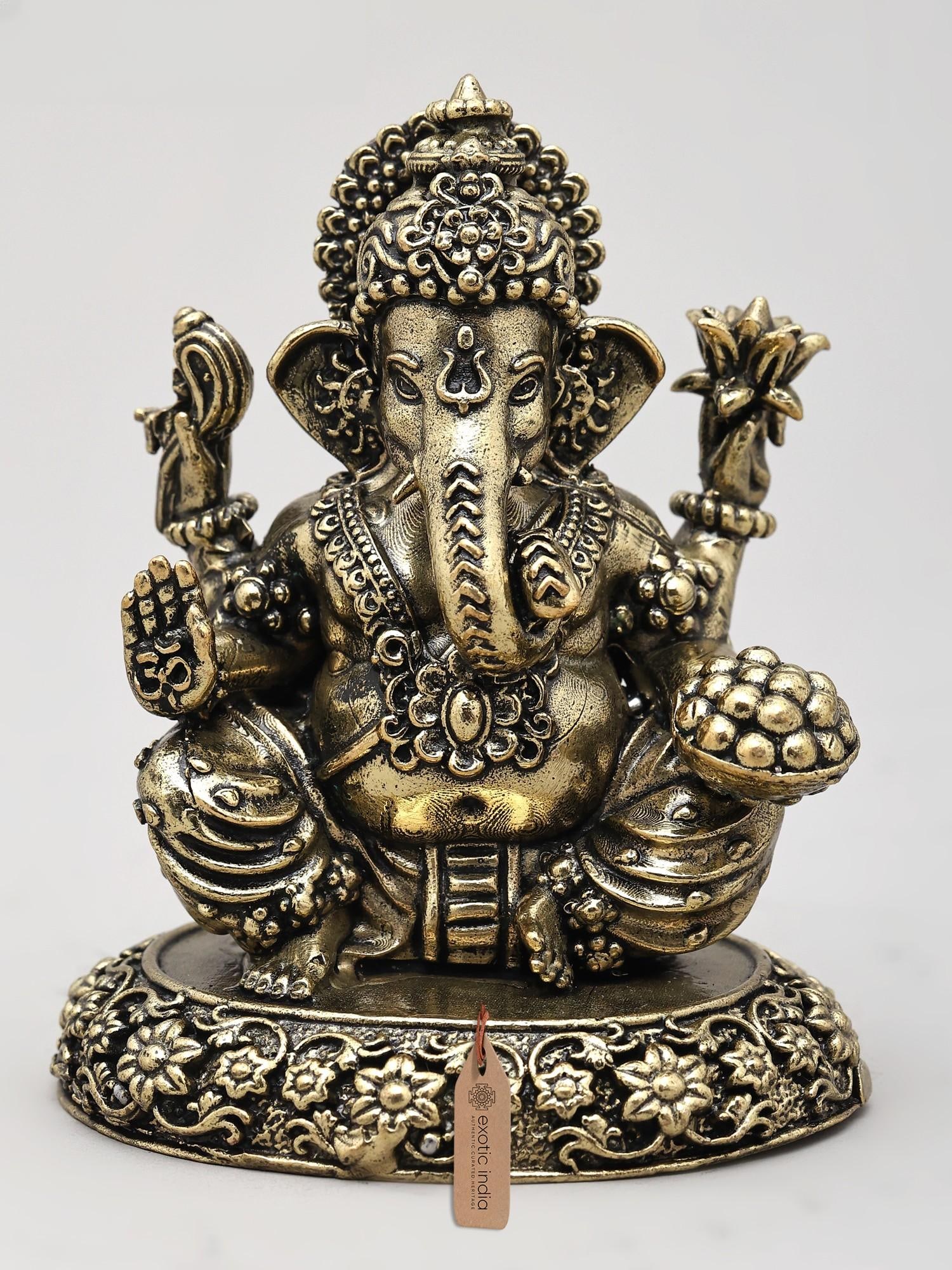3" Small Superfine Four Armed Blessing Lord Ganesha | Brass Statue: The Remover of Obstacles This exquisite brass statue depicts Lord Ganesha, the beloved Hindu deity revered as the remover of obstacles, the patron of arts and sciences, and the intellect. In