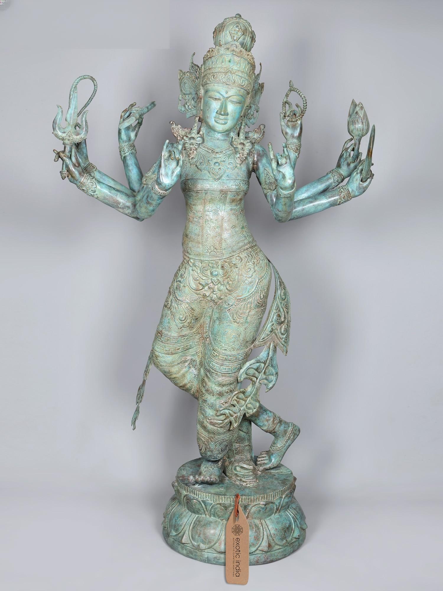 78" Huge Eight Armed Dancing Goddess Tara - Embodiment of Enlightened Grace | Brass Statue: The Divine Dance of Compassion Immerse your space in the profound grace and boundless compassion of the enlightened goddess Tara, depicted here in a majestic, eight-armed form. This magnificent statue