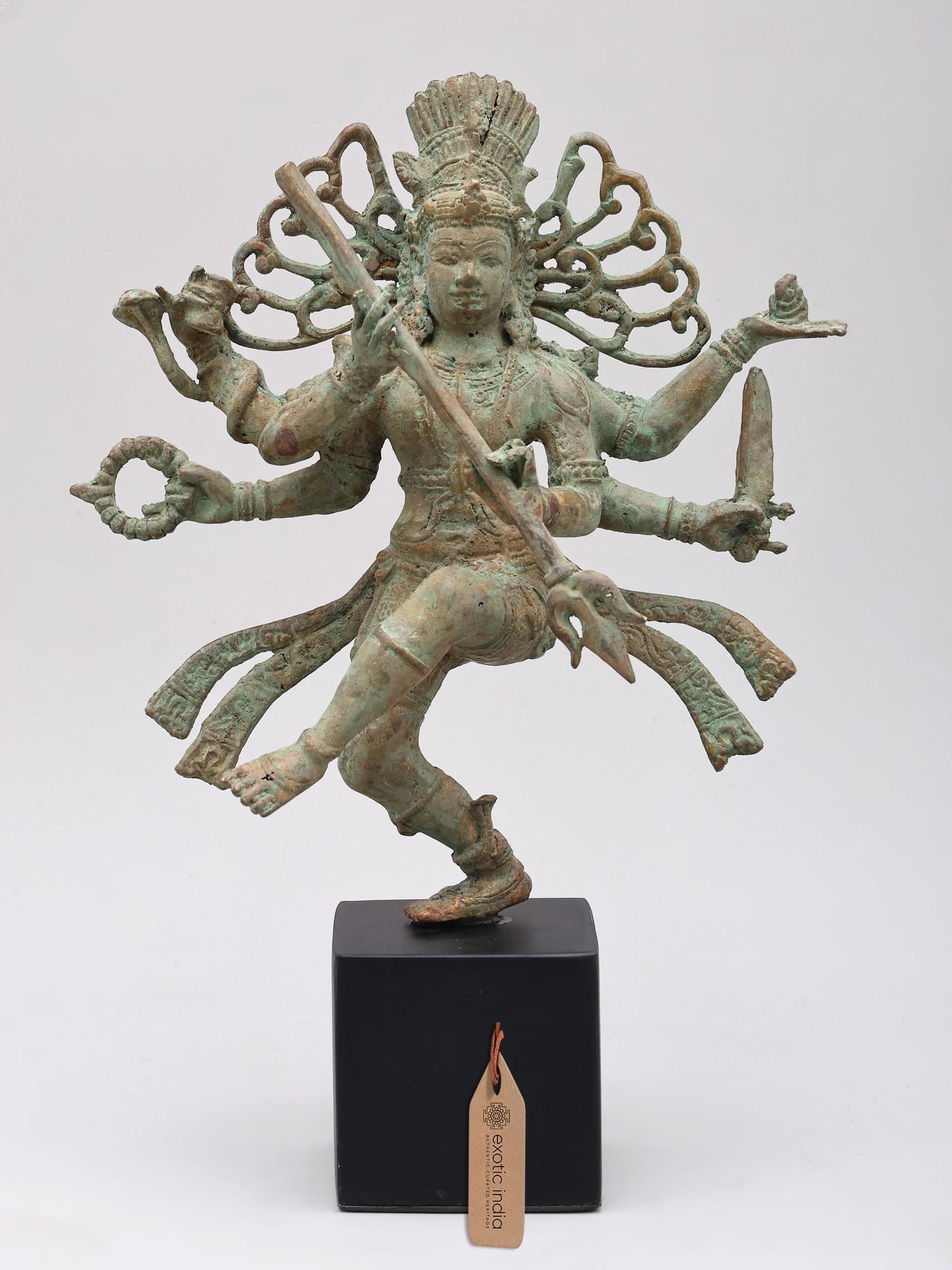 10" Dancing Lord Shiva (Nataraja) | Brass Statue on Wood Base: The Cosmic Dance of Lord Shiva This exquisite bronze statue captures the awe-inspiring depiction of Lord Shiva as Nataraja, the Lord of the Dance. In Hindu mythology, Shiva's Tandava, or cosmic dance,