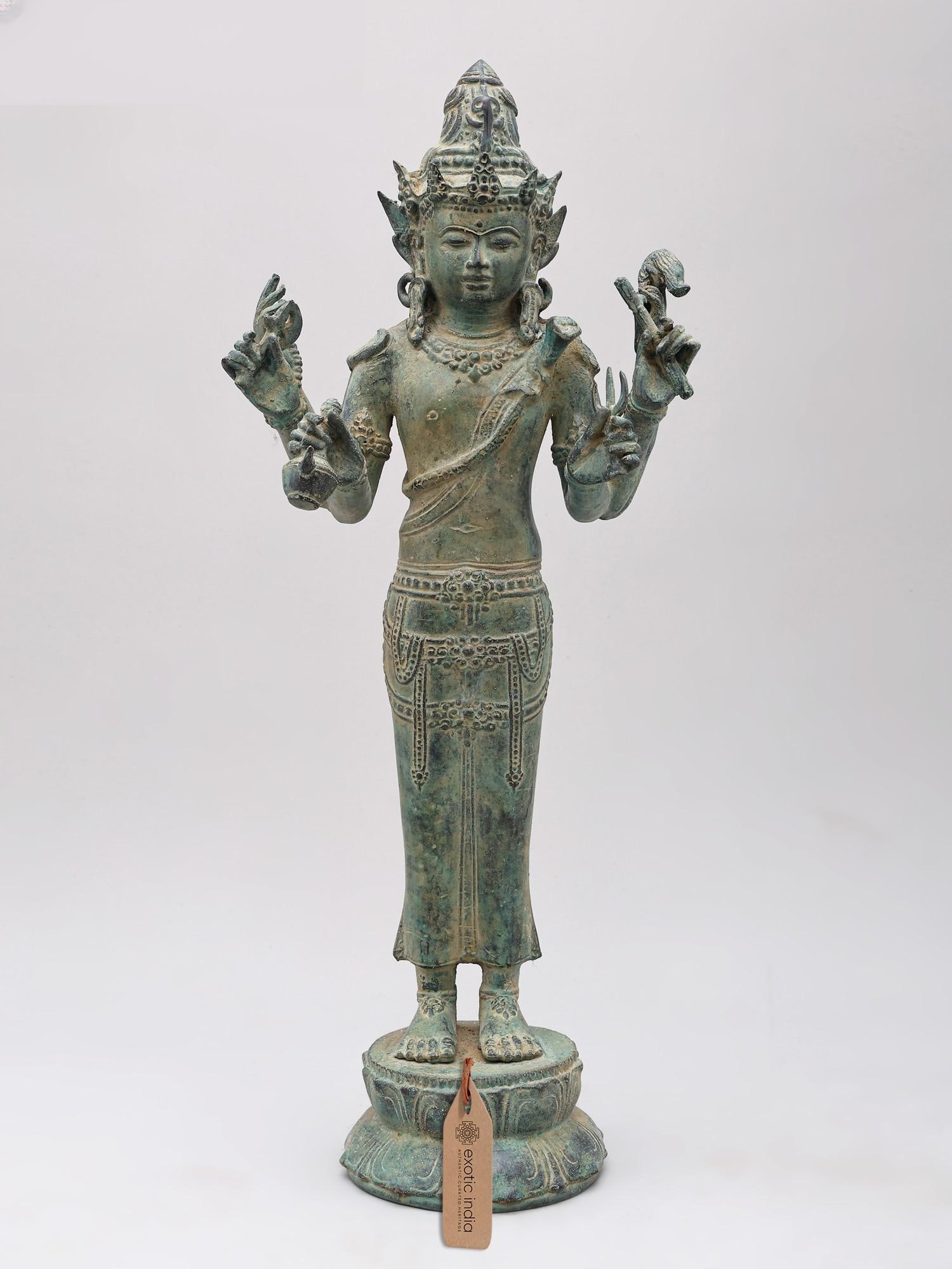 18" Lord Shiva Holding a Sannayasi's Water Pot | Brass Statue: Embodiment of Asceticism and Divine Power This commanding brass statue, standing tall at eighteen inches, captures Lord Shiva in a form that evokes both profound asceticism and his inherent divine mig