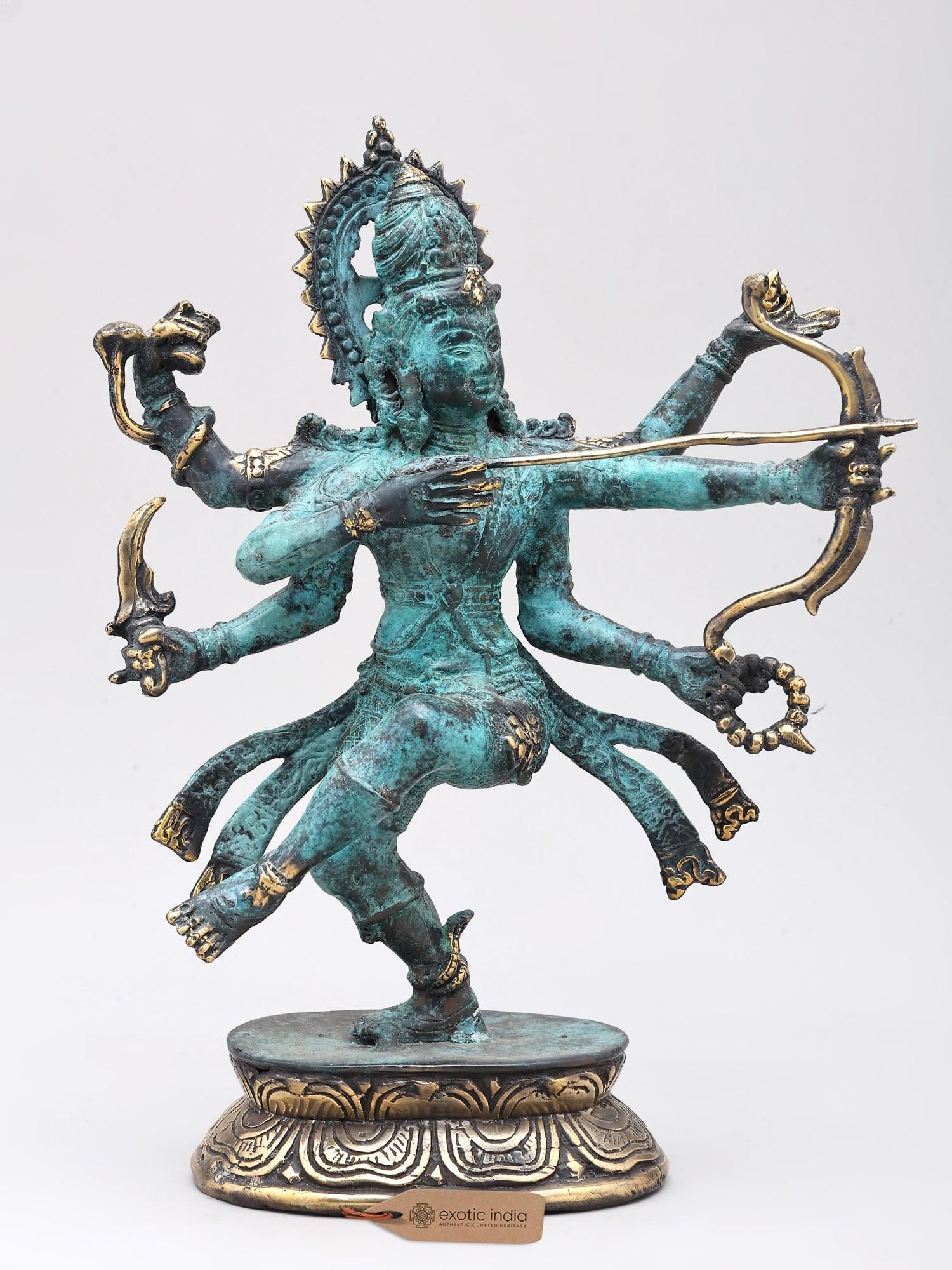 10" Pinak-Dhara Shiva | Brass Statue: A Divine Archer's Fierce Form Behold the captivating presence of this magnificent brass statue, an embodiment of divine power and celestial warfare. Crafted using the intricate lost wax method, a