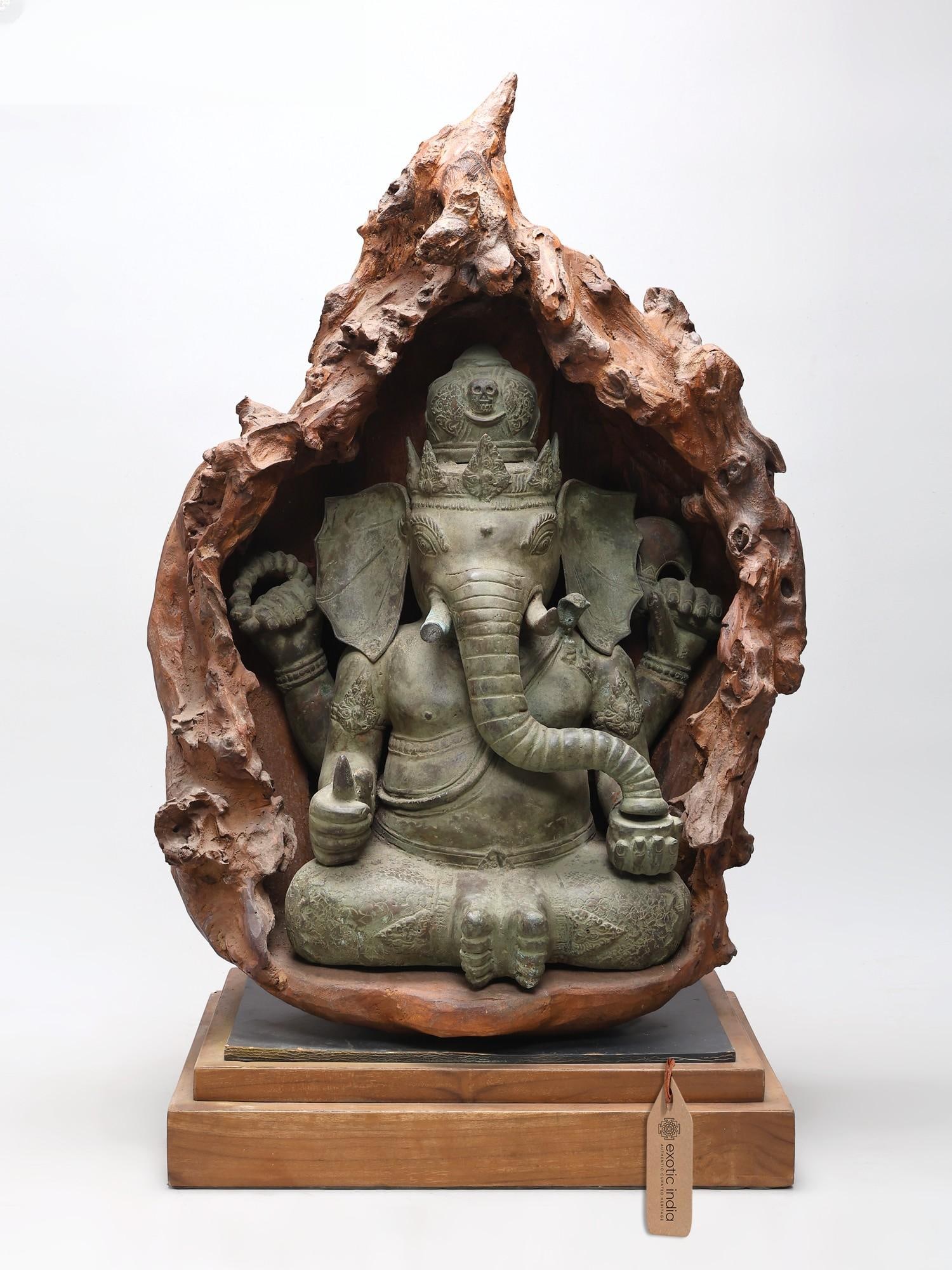 33" Four Armed Lord Ganesha Seated in Wood Cave (1 of 2)