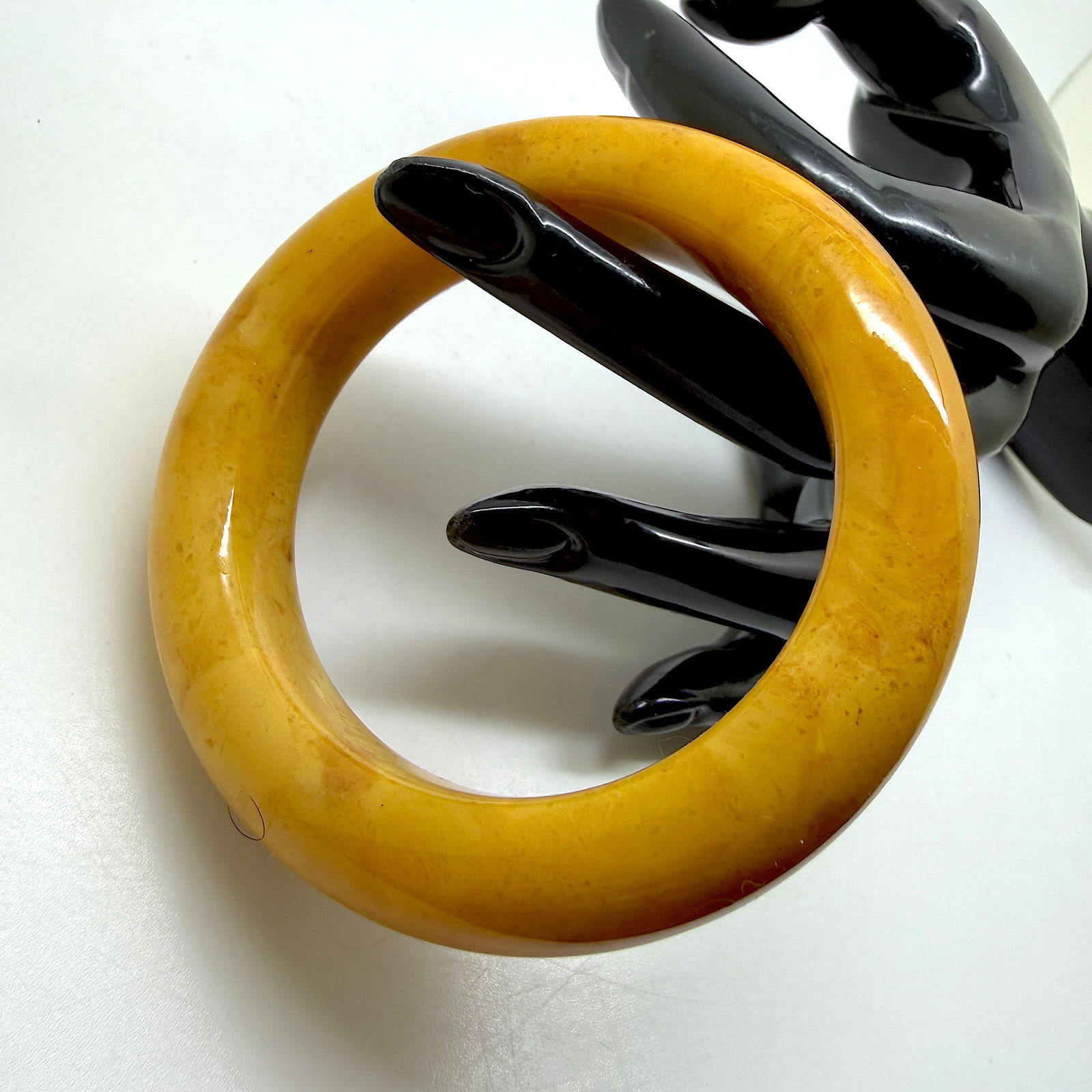Staggering Amber Bangle Bracelet: Title:Staggering Amber Bangle Bracelet Metal:None Gemstone:Reconstituted Amber Weight:37.1 g Size:79x79x16mm; ø55mm Made of:(Reconstituted Amber or Whole Stone):Reconstituted Amber Additional informa
