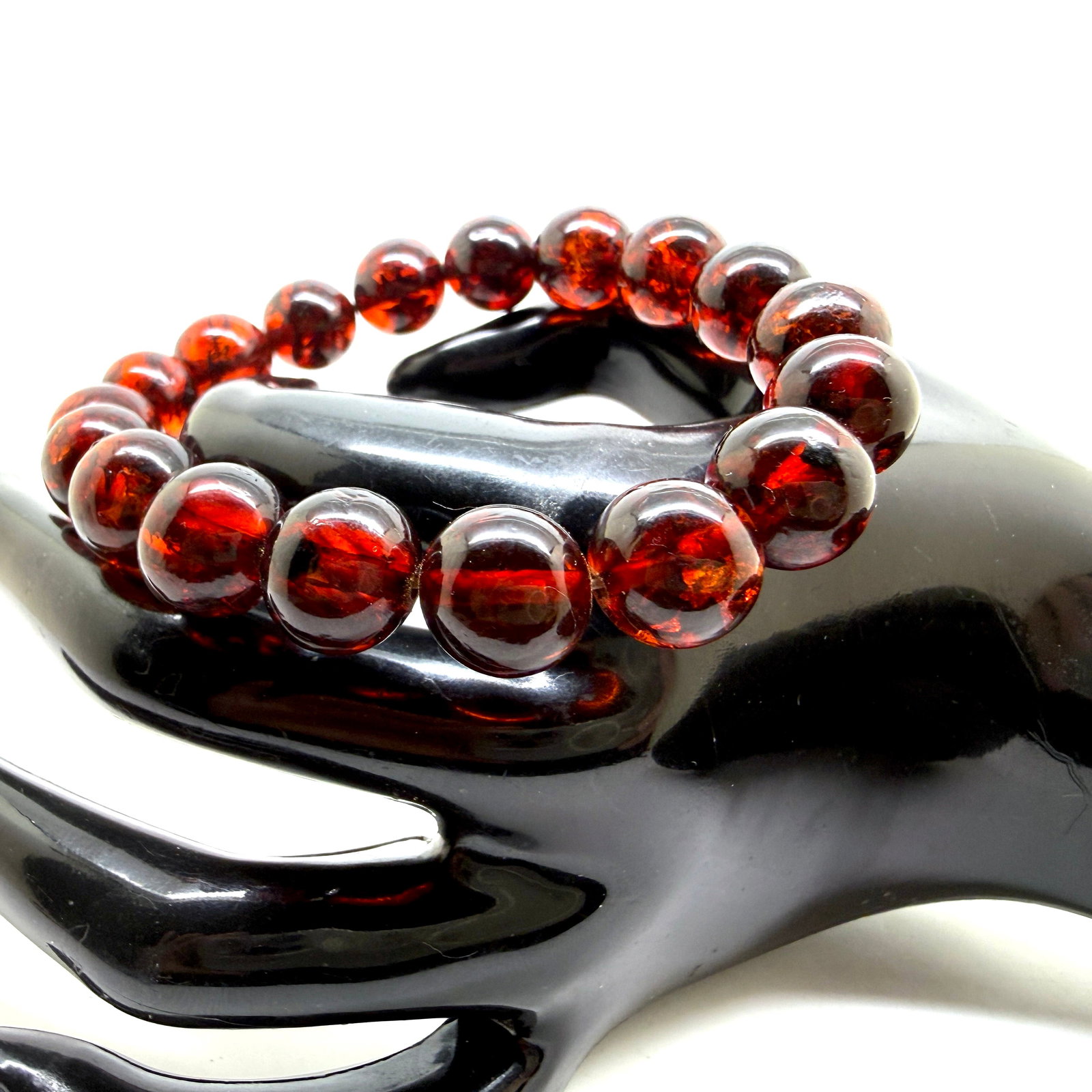 Staggering Amber Bracelet made from Round Amber beads: Title:Staggering Amber Bracelet made from Round Amber beads Metal:None Gemstone:Amber Weight:17.5 g Size:Bead size: 12.0 mm Bead size: 0.472 inches Made of:(Reconstituted Amber or Whole