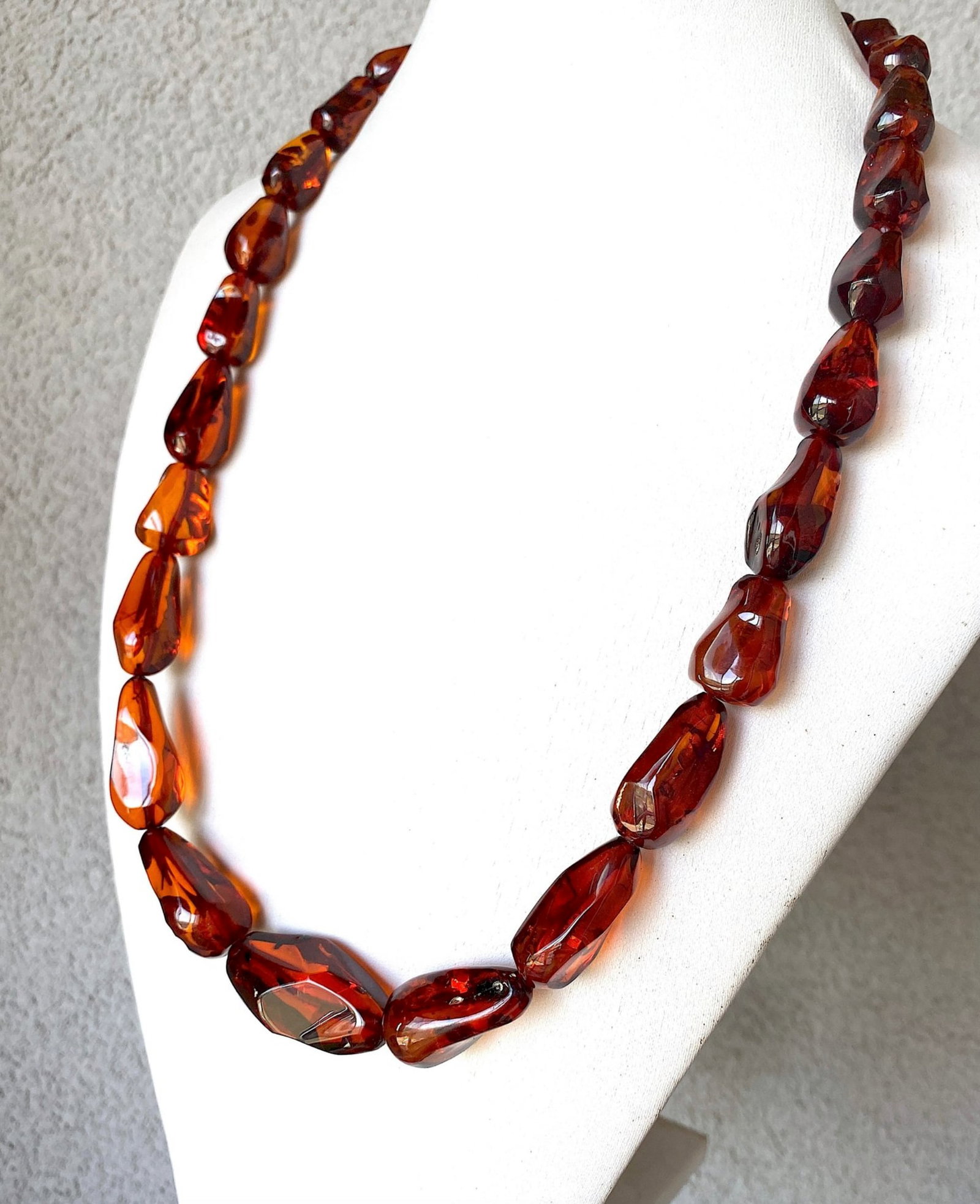 Alluring Vintage Amber Necklace made from Hand Carved Amber beads: Title:Alluring Vintage Amber Necklace made from Hand Carved Amber beads Metal:None Gemstone:Whole Stone Weight:62.6 g Size:16-40mm; 66cm Made of:(Reconstituted Amber or Whole Stone):Natural Amber
