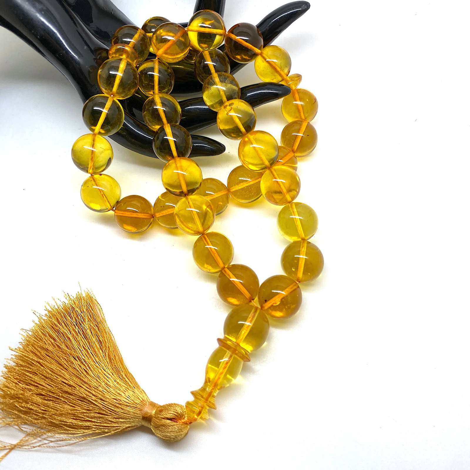 Fascinating Vintage Amber Tesbih made from Round Amber beads: Title:Fascinating Vintage Amber Tesbih made from Round Amber beads Metal:None Gemstone:Amber Weight:57.1 g Size:Bead size: 14.0 mm Bead size: 0.551 inches Made of:(Reconstituted Amber or Whole