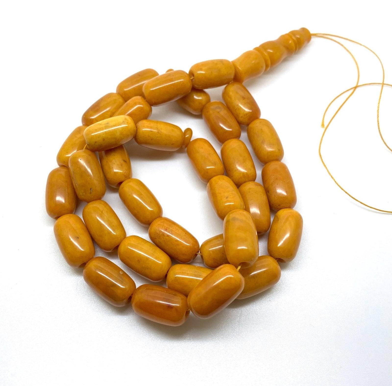 Magnificent Unique Antique Amber Tesbih made from Barrel shaped Amber beads: Title:Magnificent Unique Antique Amber Tesbih made from Barrel shaped Amber beads Metal:None Gemstone:Amber Weight:48.3 g Size:Bead size: 19.0 x 10.0 mm Bead size: 0.748 x 0.394 inches Made