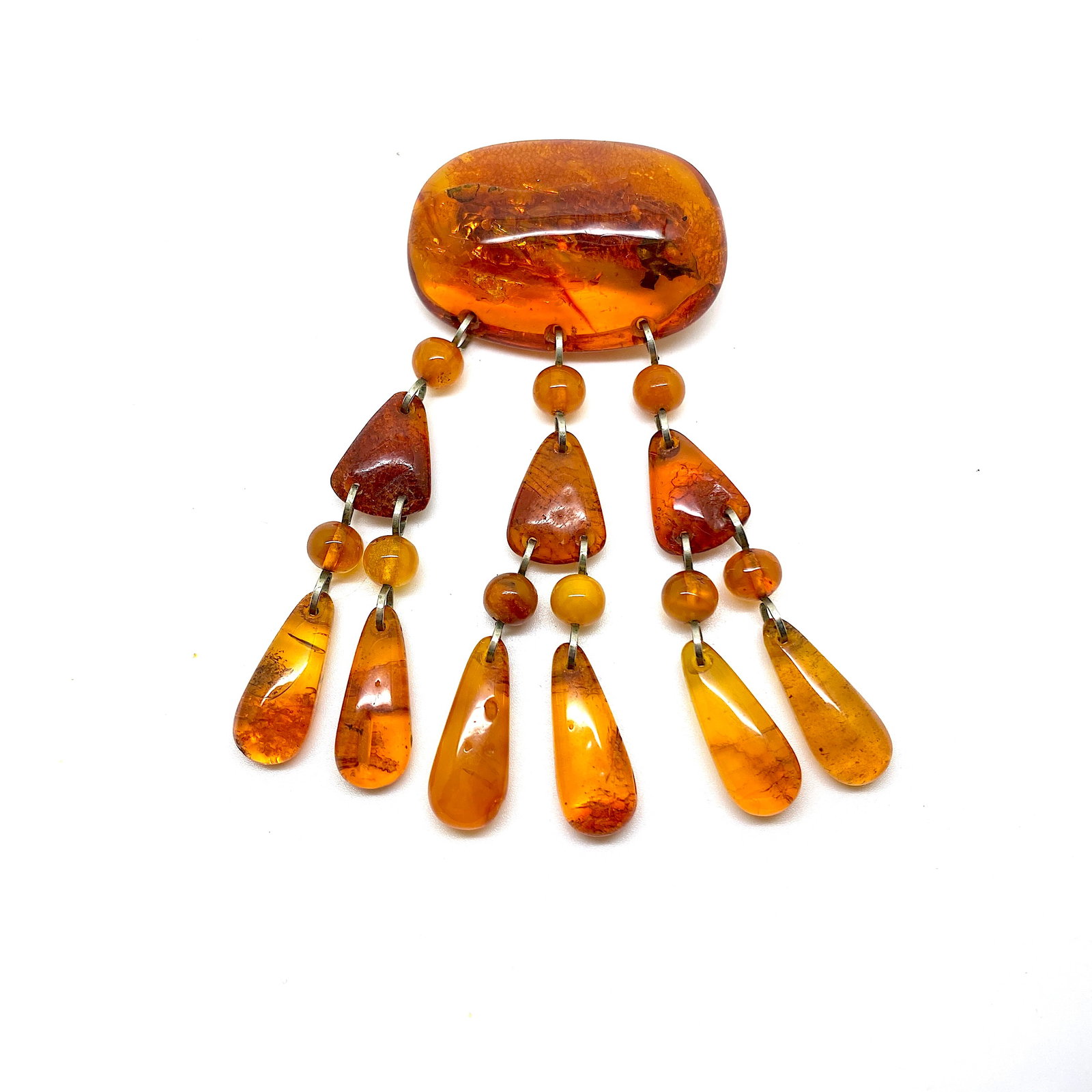 Unique and Exquisite Amber Brooch: Title:Unique and Exquisite Amber Brooch Metal:Metal Gemstone:Amber Weight:22.7 g Size:Size: 45.0 x 18.0 x 100.0 mm Size: 1.772 x 0.709 x 3.937 inches Made of:(Reconstituted Amber or Whole
