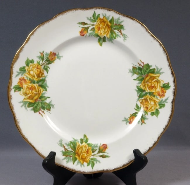 Royal Albert Yellow Tea Rose Bone China Dinner plate England Vintage: This is a stunning Fine Bone China Dinner Plate, from the famous Yellow Tea rose Collection by Royal Albert in England. It is properly marked with Royal Albert back stamp and pattern number 839056The 