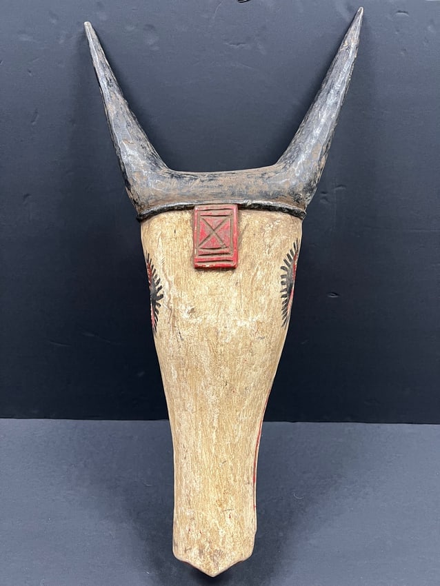 African Tribal Art Carved Wood Bozo Antelope Mask: DescriptionTitle: Bozo Antelope MaskDate/Period: Late 20th CenturyMaterials: WoodSize: 25" h x 13.5" wReserve: $150.00Shipping:Domestic: Flat-rate of $40.00 to anywhere within the contiguous U.S.Inter