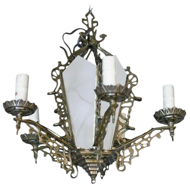 Art Deco Slat Glass Brass Dining Room Chandelier W/ Geometric Details: Title: Art Deco Slat Glass Brass Dining Room Chandelier W/ Geometric Details Description: Six-arm geometric Art Deco chandelier with candle-style lights and a light-up slat glass center. The piece fea