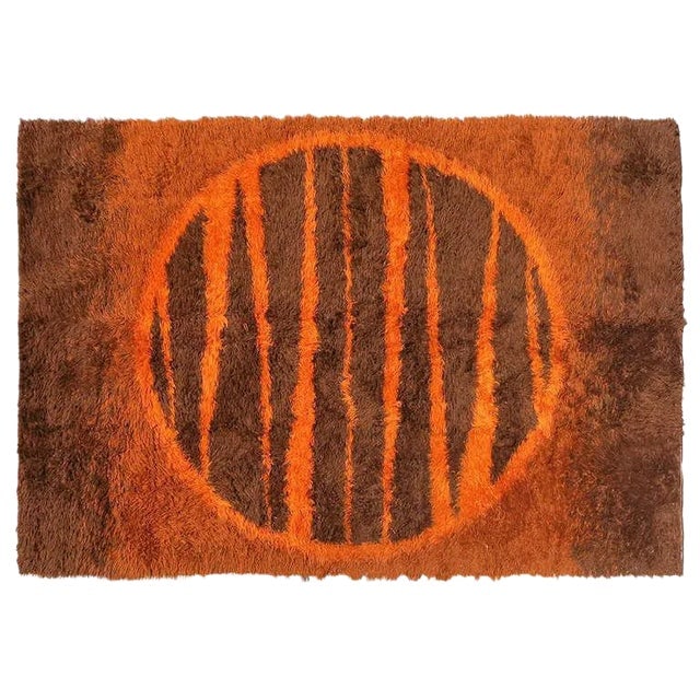 Supernova Shag Rug With Abstract Design, Circa 1970: Title: Supernova Shag Rug With Abstract Design, Circa 1970 Description: Post-Modern shag wool area rug with an abstract design resembling a sun featuring various shades of browns and burnt orange. A