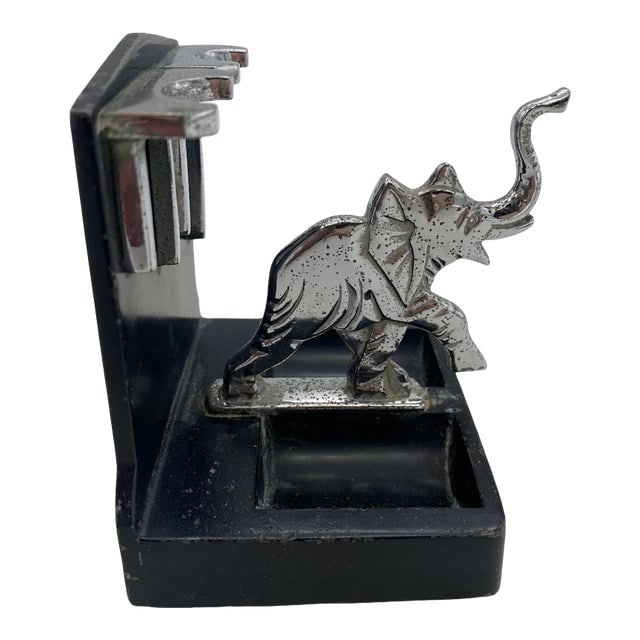 1930s Ronson Art Deco Chrome Elephant Pipe Holder: Title: 1930s Ronson Art Deco Chrome Elephant Pipe Holder Description: A Ronson Elephant two Pipe Holder with a Chrome elephant and accents with a black powder coat base. It is listed in advertisement