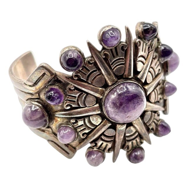 1940's Taxco William Spratling Silver With Amethyst Sun Motif Cuff Bracelet: Title: 1940's Taxco William Spratling Silver With Amethyst Sun Motif Cuff Bracelet Description: Designed and signed by William Spratling after his move to Taxco in 1929, this bracelet reflects the rev