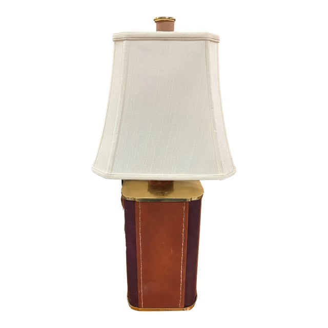 1970s Two-Toned Square Leather Wrapped Table Lamp With Gold Trim: Title: 1970s Two-Toned Square Leather Wrapped Table Lamp With Gold Trim Description: The dual-tone leather in wine and brown, combined with gold accents, adds a sophisticated and luxurious feel typica