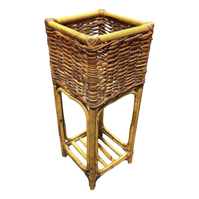 Mid Century Cubed Woven Rattan Pedestal Plant Stand: Title: Mid Century Cubed Woven Rattan Pedestal Plant Stand Description: This beautifully restored cubed woven rattan plant stand is a charming blend of natural textures and timeless Paul T Frankl