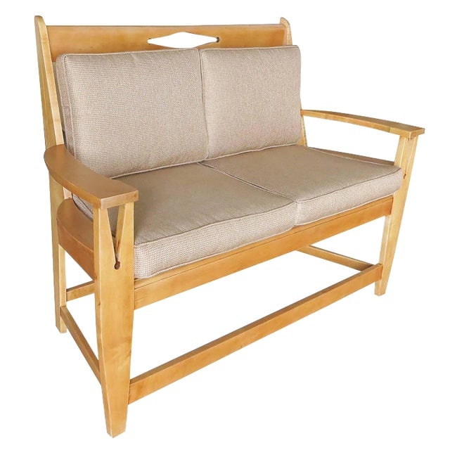 Blonde Wood Sofa With Clothespin Shaped Accents (1 of 6)