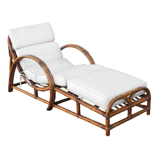 Restored Two-Strand "Half Moon" Rattan Cup Seat Chaise Lounge: Title: Restored Two-Strand "Half Moon" Rattan Cup Seat Chaise Lounge Description: Mid-Century Era two-strand "Half Moon" rattan lounge chair with slop cup seat. This chair features a 2 strand loop arm