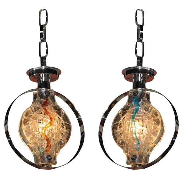 Vistosi Gino Murano Glass Pendant Lights, Pair: Title: Vistosi Gino Murano Glass Pendant Lights, Pair Description: Pair of Mid-Century Murano glass pendant lights by Gino Vistosi, featuring textured clear glass with vibrant internal swirls in blue 