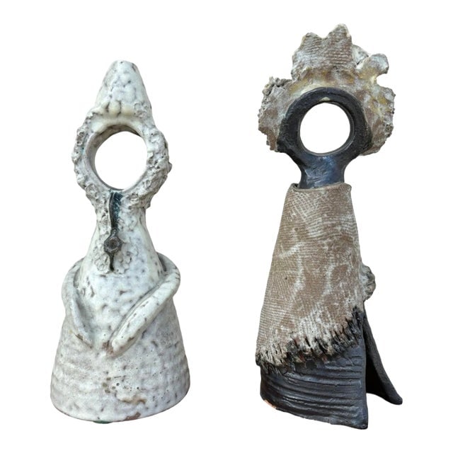 Terracota Glazed Anthropomorphic Sculpture Male and Female Pair Signed by Artist: Title: Terracota Glazed Anthropomorphic Sculpture Male and Female Pair Signed by Artist Description: The male figure is cone-shaped, with arms gently cradling his hands to his stomach, embodying intro