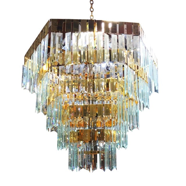 1970's Modernist Hanging Crystal Brass Chandelier: Title: 1970's Modernist Hanging Crystal Brass Chandelier Description: Circa 1970s late Modernist hanging crystal brass chandelier featuring a 5-level brass-framed chandelier holding over 300 cut cryst