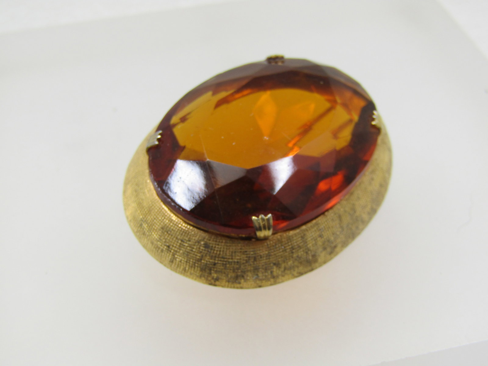 Vntage Chunky Amber Glass Brooch, 1960's, 1-7/8" by 1.5": Title: Vntage Chunky Amber Glass Brooch, 1960's, 1-7/8" by 1.5" Description: Vntage Chunky Amber Glass Brooch, 1960's, 2" by 1.5". The stone is faceted amber glass prong-set stone that is appx. 1.7/5"