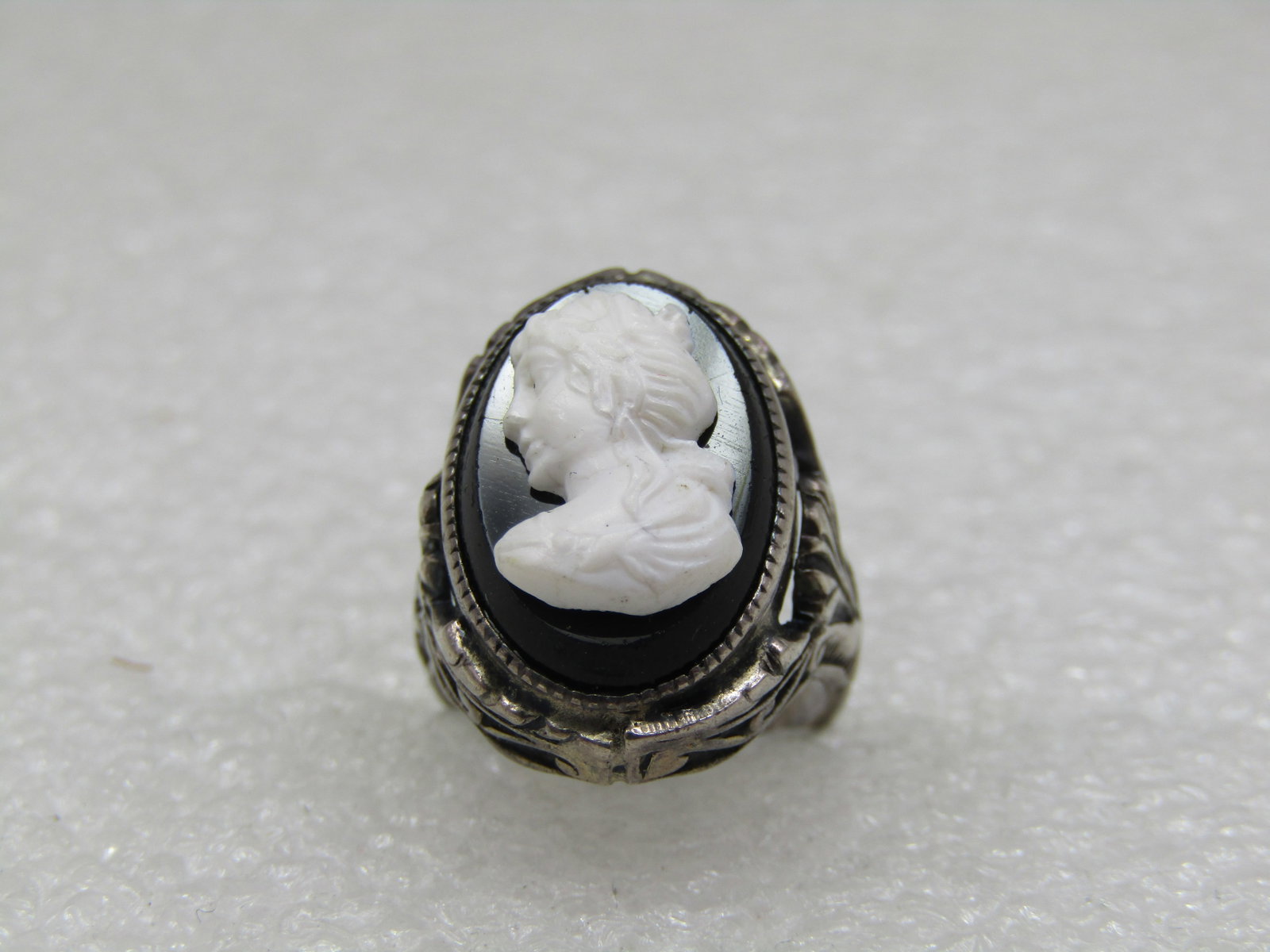 Vintage Sterling Cameo Ring, Sz. 3, Pre Mid Century: Title: Vintage Sterling Cameo Ring, Sz. 3, Pre Mid Century Description: Vintage Sterling Cameo Ring, Sz. 3, Pre Mid Century. Black and white glass cameo with ornate setting and band, Victorian themed.