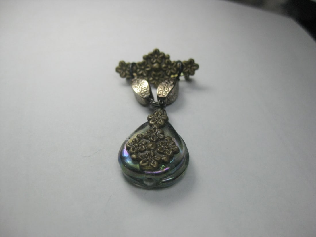 Vintage Brass & Iridescent Glass Bar & Dangle Brooch, Victorian Themed: Title: Vintage Brass & Iridescent Glass Bar & Dangle Brooch, Victorian Themed Description: Vintage Brass floral bar brooch from which designed beads are set with a dangle teardrop rainbow glass stone 