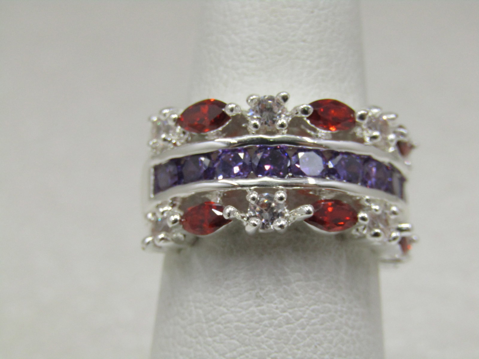 Silver Plated Rhinestone Band Ring, Red/Purple/Clear, Sz. 6.75, Cigar Band: Title: Silver Plated Rhinestone Band Ring, Red/Purple/Clear, Sz. 6.75, Cigar Band Description: Silver Plated Rhinestone Band Ring, Sz. 6.75, Cigar Band and appx. 10mm wide with a mix of marquise red