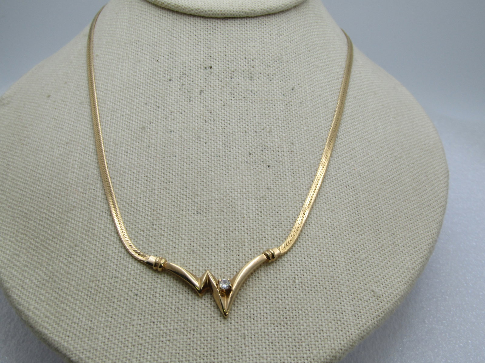 Vintage ZigZag Rhinestone Drop Necklace, 18", 1980's: Title: Vintage ZigZag Rhinestone Drop Necklace, 18", 1980's Description: Vintage ZigZag Rhinestone Drop Necklace, 18", 1980's. This has a lightening bolt style drop with a single clear rhinestone that