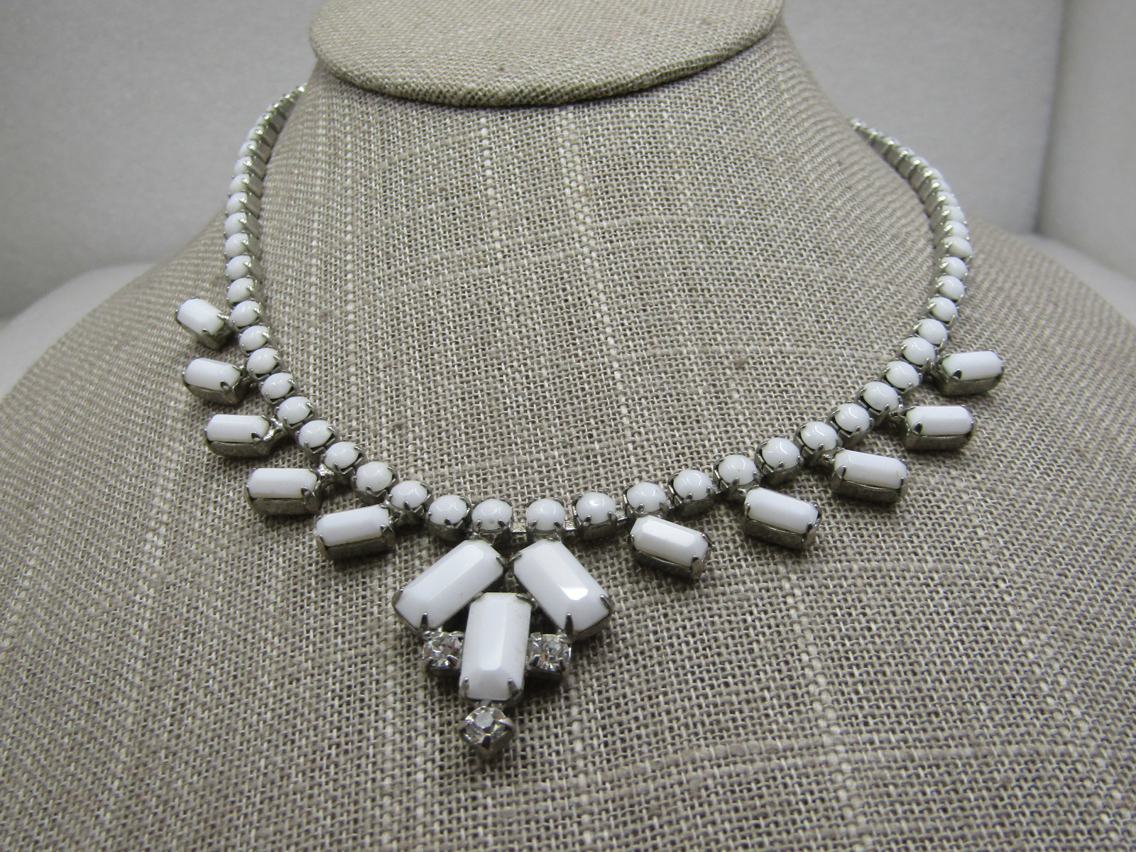 Vintage White Milk Glass & Rhinestone Bib Necklace, 16": Title: Vintage White Milk Glass & Rhinestone Bib Necklace, 16" Description: Vintage White Milk Glass & Rhinestone Bib Necklace, 16". Mid-Century. Round and baguettes with hook clasp. Round prong-set s