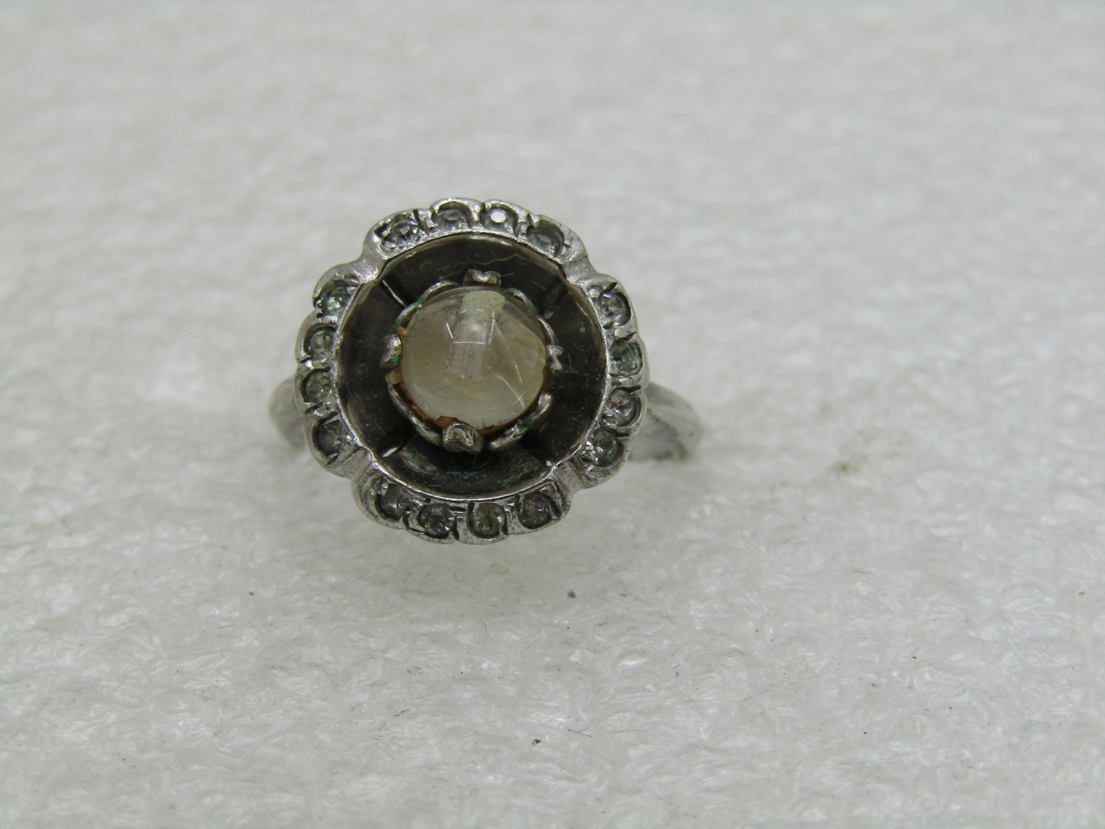 Vintage Sterling Uncas Clear Stone Ring, Art Deco, Sz. 6, Halo (NL): Title: Vintage Sterling Uncas Clear Stone Ring, Art Deco, Sz. 6, Halo (NL) Description: Vintage Sterling Uncas Clear Stone Ring, Art Deco, Sz. 6, Halo, Singed Uncas and marked sterling and tested. Wei
