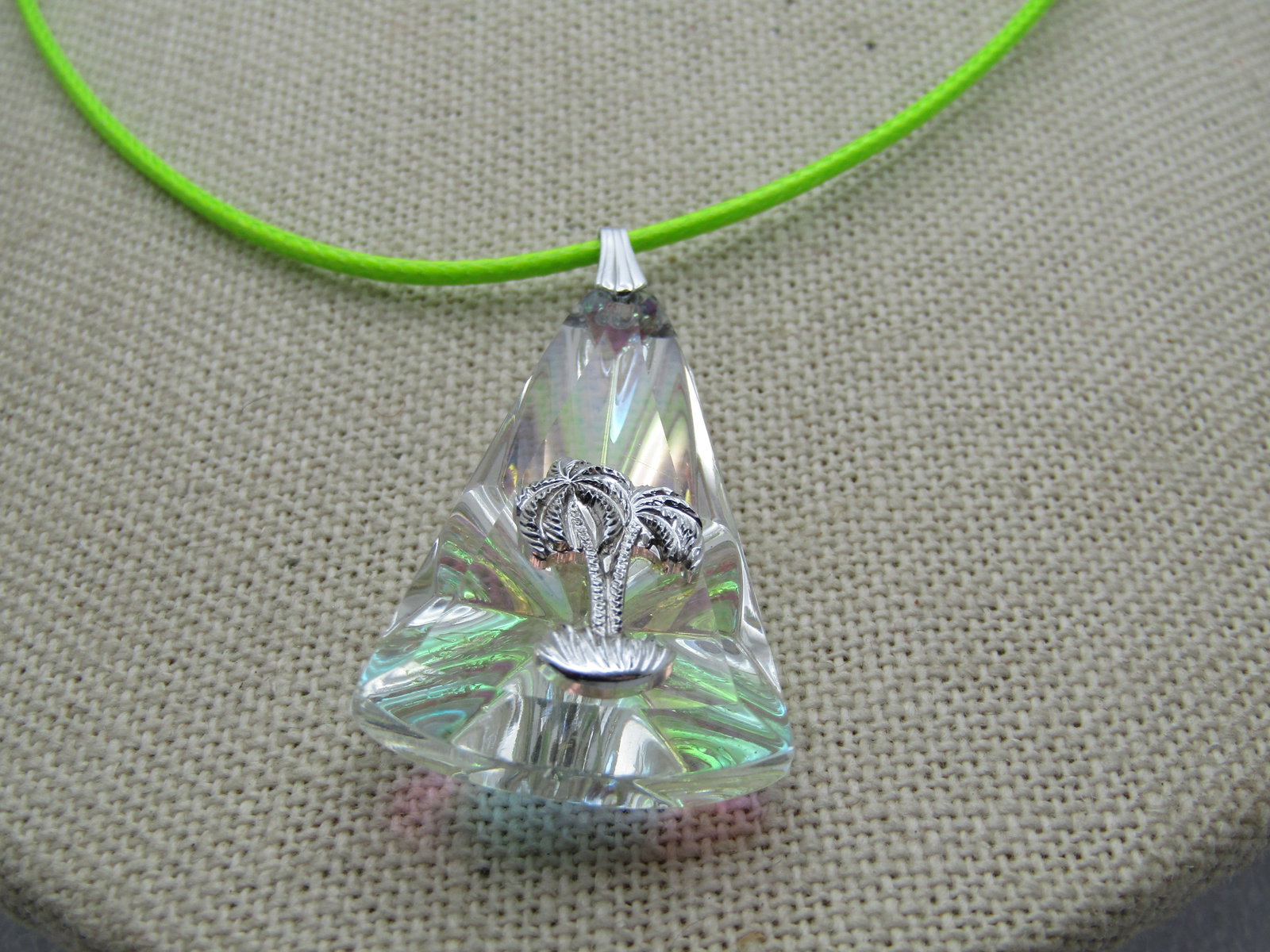 Vintage Rainbow Shimmer Palm Tree Glass Necklace, 16"-18": Title: Vintage Rainbow Shimmer Palm Tree Glass Necklace, 16"-18" Description: Vintage Rainbow Shimmer Palm Tree Glass Necklace, 16"-18". The pendant is a tapered rainbow pressed glass faux prisim with