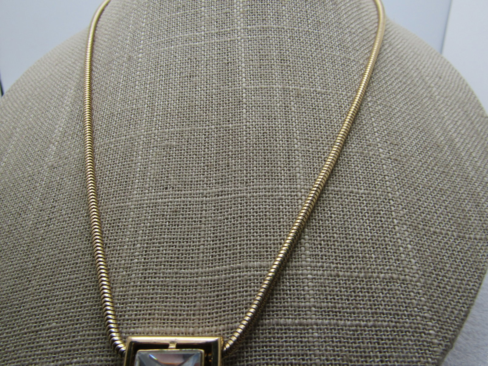 Vintage Avon Square Rhinestone Necklace, 18" Snake Chain, 1980's: Title: Vintage Avon Square Rhinestone Necklace, 18" Snake Chain, 1980's Description: Vintage Avon Square Rhinestone Necklace, 18" Snake Chain, 1980's. Gold tone. The pendant is a 3/4" gold tone framed