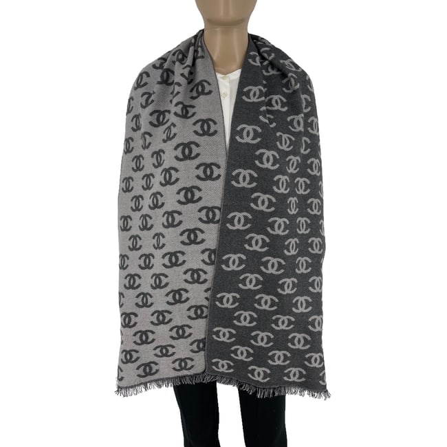 Chanel Grey Printed 65% Cashmere 35% Silk Scarf: Title:Chanel Grey Printed 65% Cashmere 35% Silk Scarf Brand:Chanel Date/Period:Modern Materials:65% Cashmere 35% Silk Size:One Size Description:Chanel Grey Printed 65% Cashmere 35% Silk Scarf Reserve: