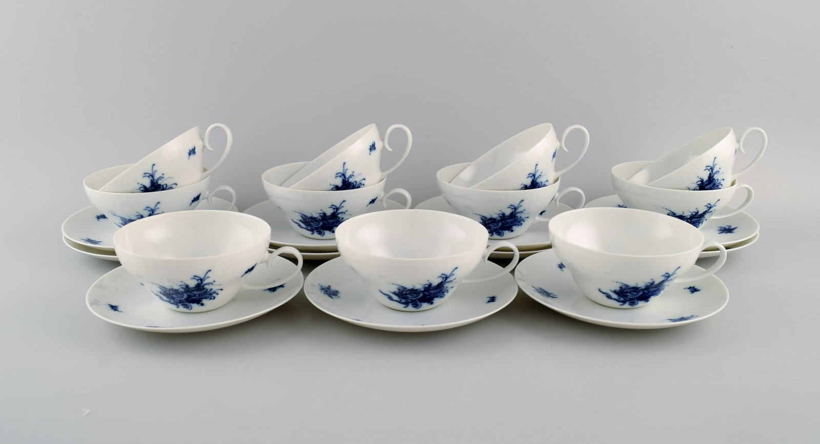 Bjorn Wiinblad for Rosenthal. 11 Romanze Blue Flower teacups with saucers. 1960s.: Title: Bjorn Wiinblad for Rosenthal. 11 Romanze Blue Flower teacups with saucers. 1960s. Description: Bjorn Wiinblad for Rosenthal. 11 Romanze Blue Flower teacups with saucers. 1960s. The cup
