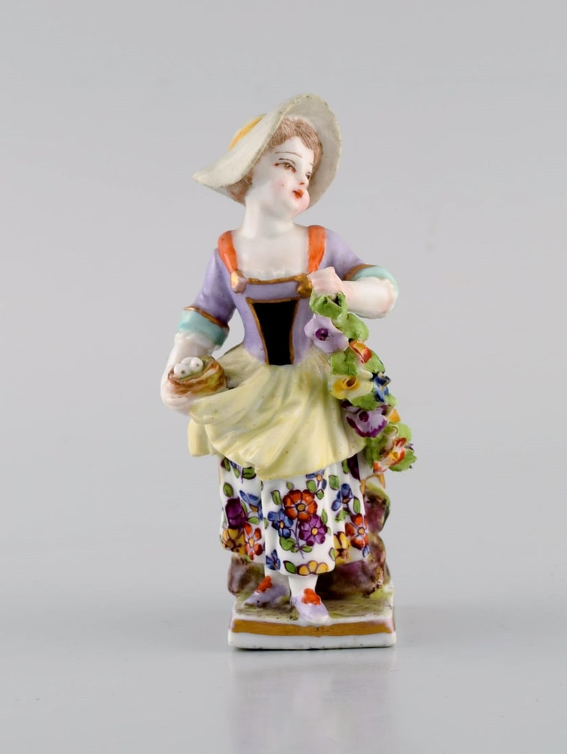 Augustus Rex, Germany. Antique hand-painted porcelain figure. Girl with flowers and fruit. 19th: Title: Augustus Rex, Germany. Antique hand-painted porcelain figure. Girl with flowers and fruit. 19th century. Description: Augustus Rex, Germany. Antique hand-painted porcelain figure. Girl with flo