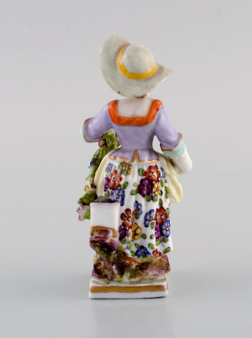 Augustus Rex, Germany. Antique hand-painted porcelain figure. Girl with flowers and fruit. 19th - 6