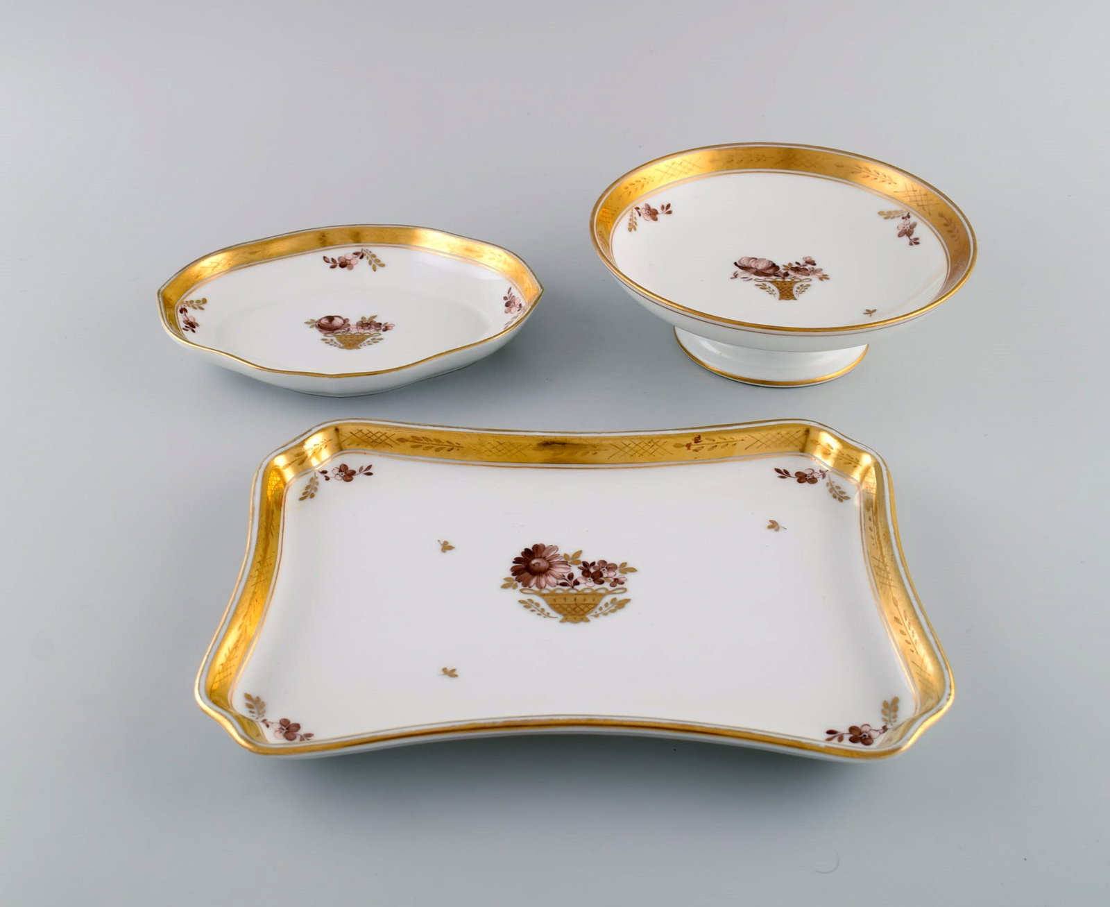 Three Royal Copenhagen Golden Basket dishes in porcelain with flowers and gold decoration. Early - 2