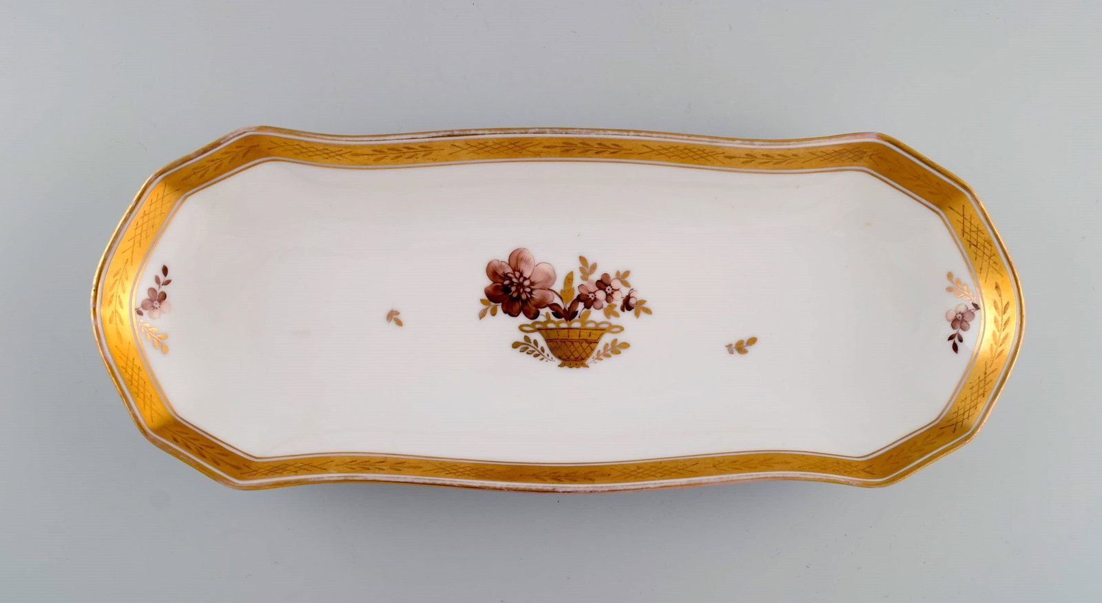 Oblong Royal Copenhagen Golden Basket serving dish in porcelain with flowers and gold decoration.: Title: Oblong Royal Copenhagen Golden Basket serving dish in porcelain with flowers and gold decoration. Model number 595/9442. Early 20th century. Description: Oblong Royal Copenhagen Golden Basket