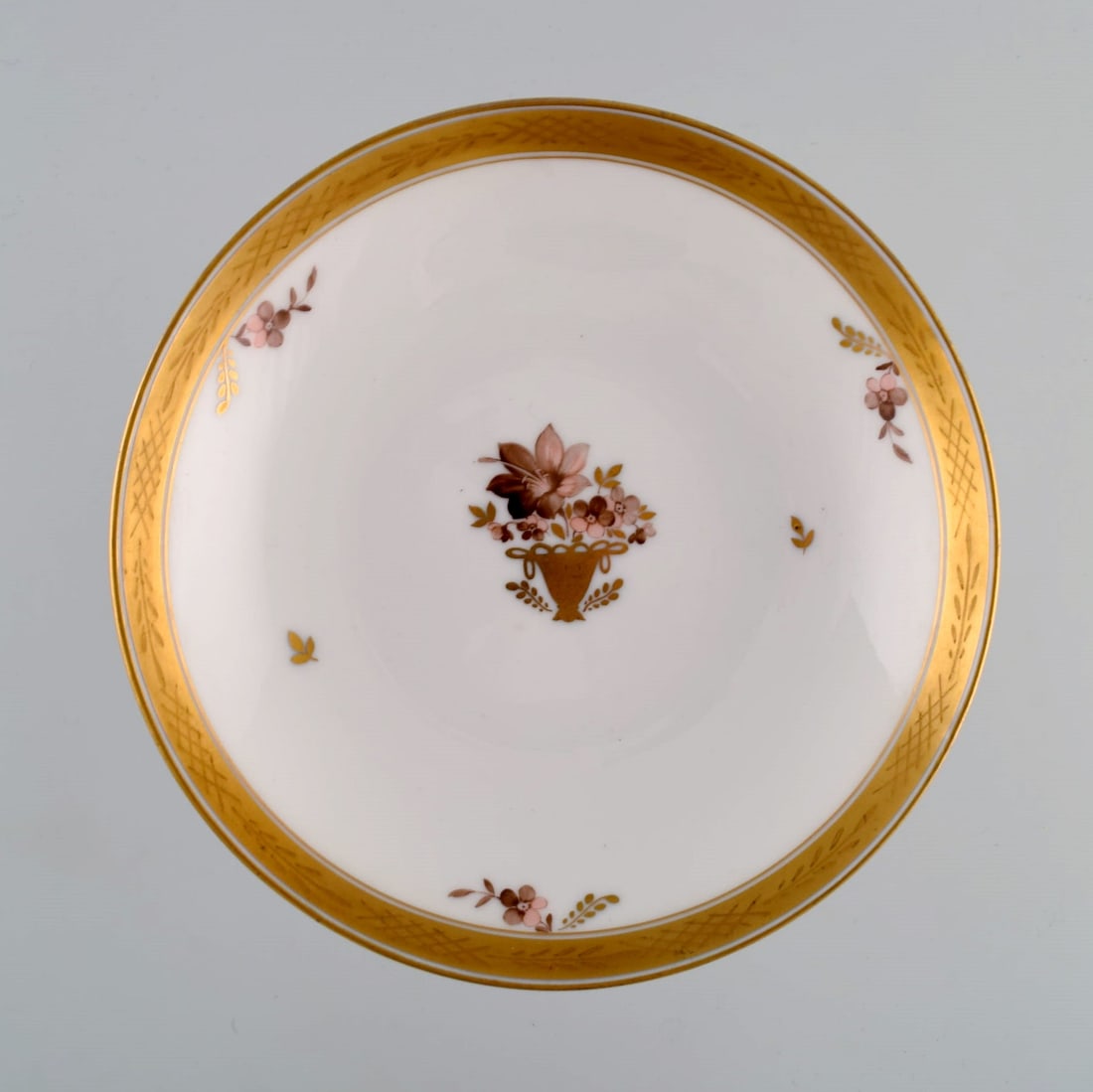 Royal Copenhagen Golden basket compote in porcelain with flowers and gold decoration. Model number - 4