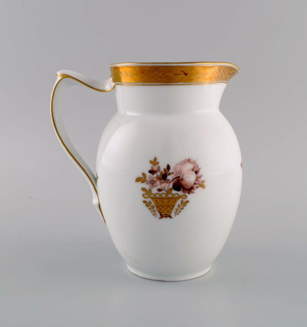 Royal Copenhagen Golden basket jug in porcelain with flowers and gold decoration. Model number - 3
